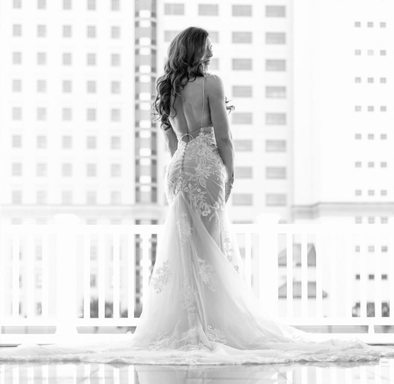 Bride on a balcony, seen from behind
