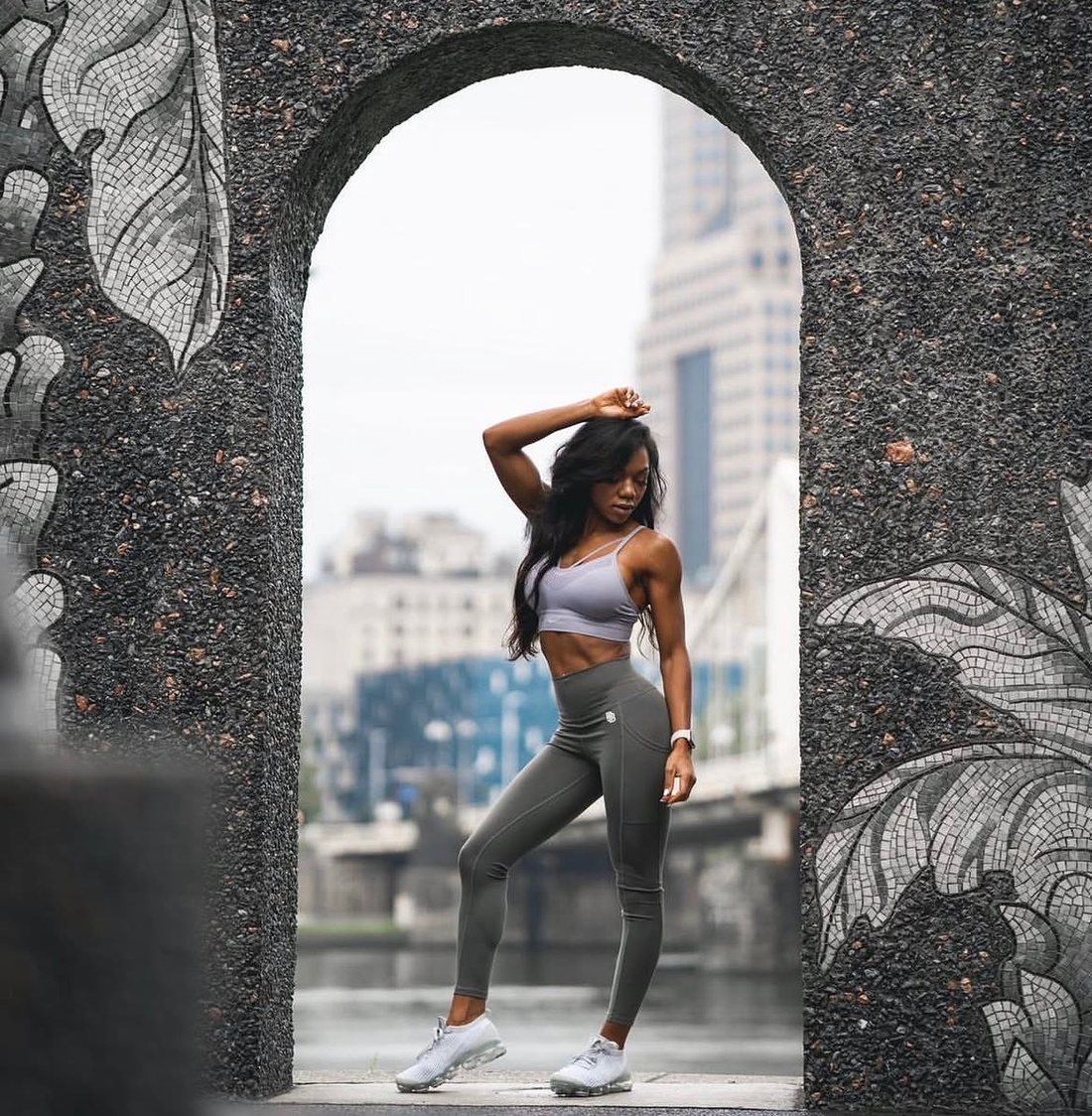 Woman in training clothes walking through the city